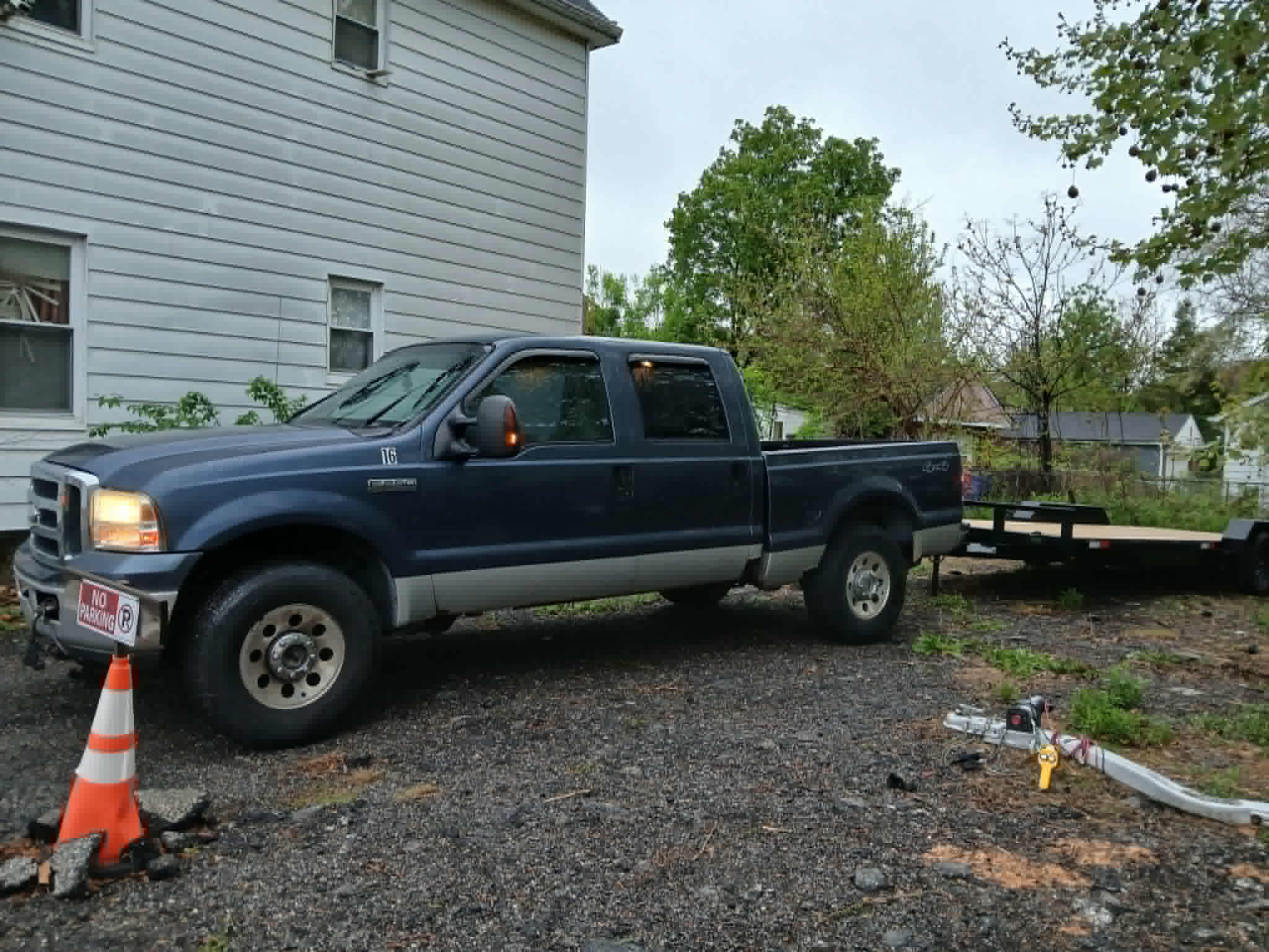 S.G Towing’s blue truck and vehicle transport trailer